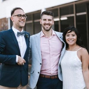 couple get photo with celebrant after ceremony