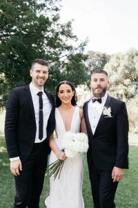 couple have picture with celebrant at botanical gardens