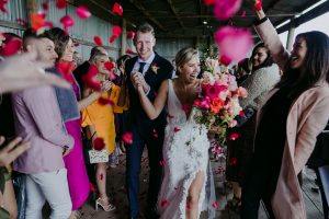 loving couple getting married with flowers